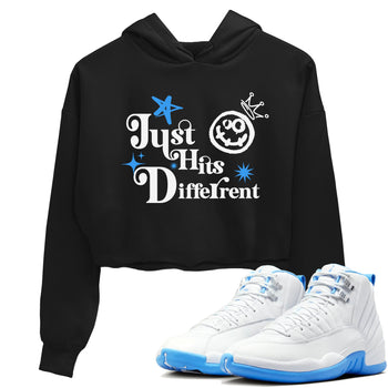 Just Hits Different womens crop tee made to vibe with the Air Jordan 12 White and University Blue sneakers — the perfect match in Black 1.