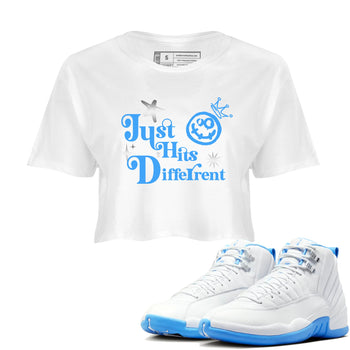 Just Hits Different womens crop tee made to vibe with the Air Jordan 12 White and University Blue sneakers — the perfect match in White 1.