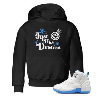 Just Hits Different baby and kids t-shirt crafted for little sneakerheads to shine with the Air Jordan 12 White and University Blue sneakers, displayed in Black 1.