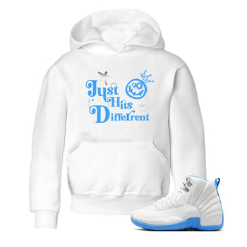 Just Hits Different baby and kids t-shirt crafted for little sneakerheads to shine with the Air Jordan 12 White and University Blue sneakers, displayed in White 1.