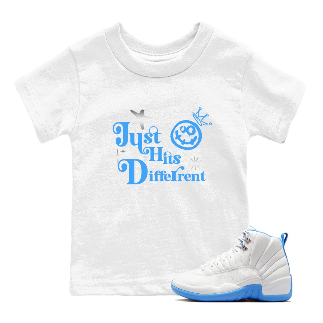 Just Hits Different baby and kids t-shirt crafted for little sneakerheads to shine with the Air Jordan 12 White and University Blue sneakers, displayed in White 1.