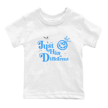 Just Hits Different baby and kids t-shirt crafted for little sneakerheads to shine with the Air Jordan 12 White and University Blue sneakers, displayed in White 2.