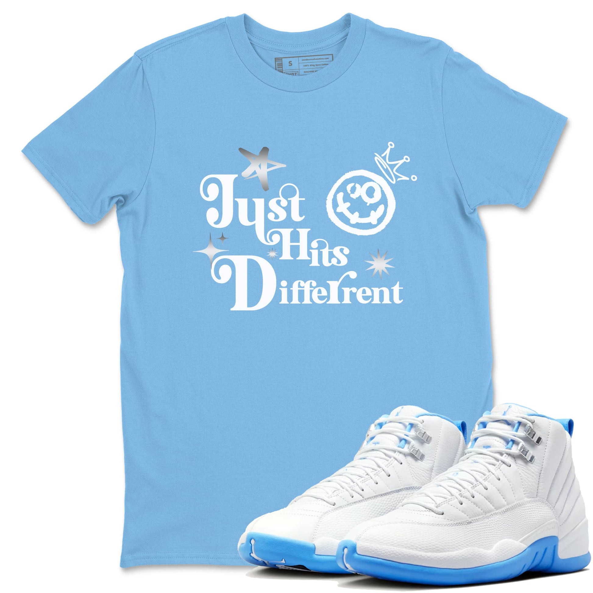 Just Hits Different sneaker match t-shirt styled to complete your fit with the Air Jordan 12 White and University Blue sneakers, shown in Carolina Blue 1.