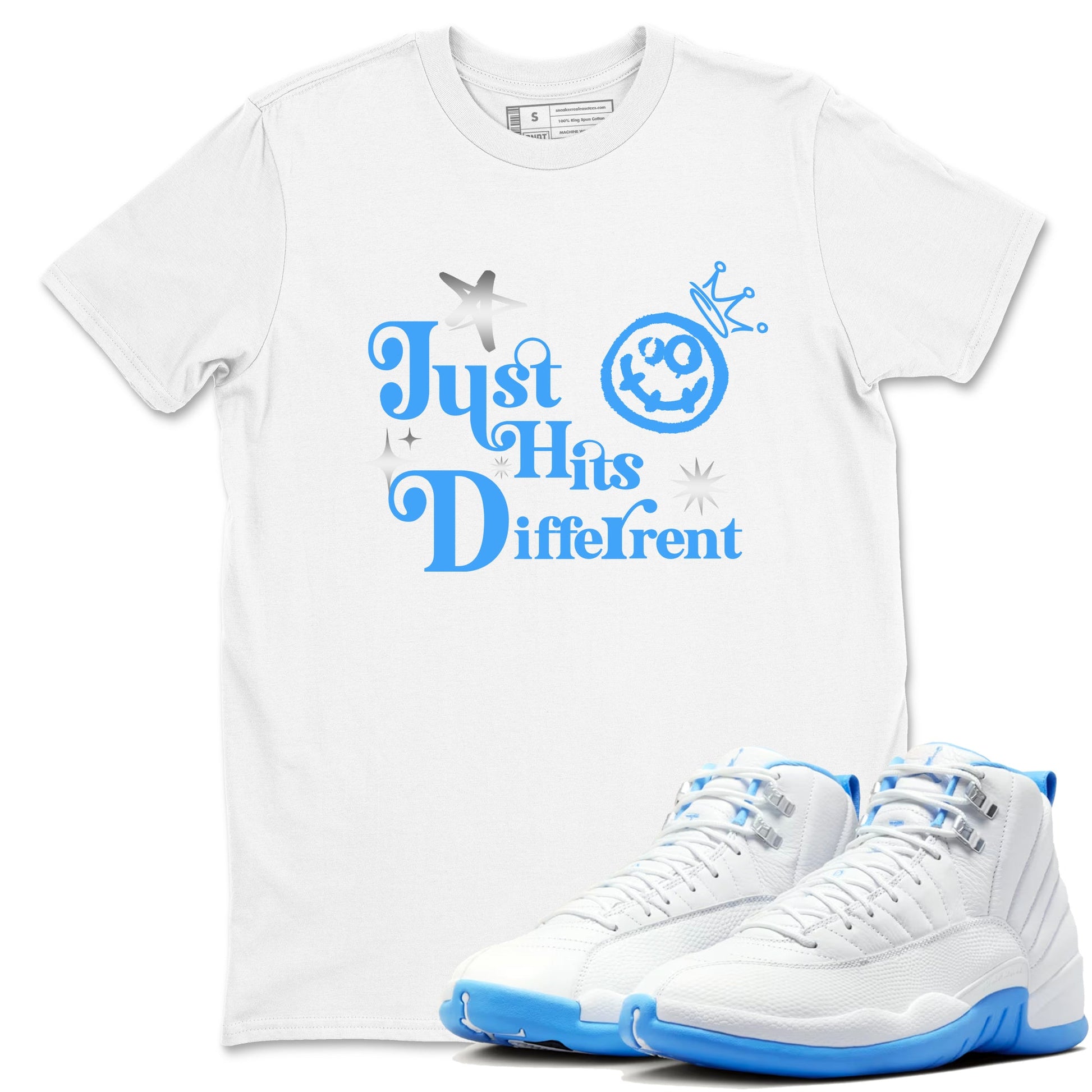 Just Hits Different sneaker match t-shirt styled to complete your fit with the Air Jordan 12 White and University Blue sneakers, shown in White 1.