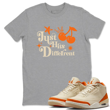 Just Hits Different sneaker match t-shirt styled to complete your fit with the Air Jordan 3 Starfish sneakers, shown in Heather Grey 1.