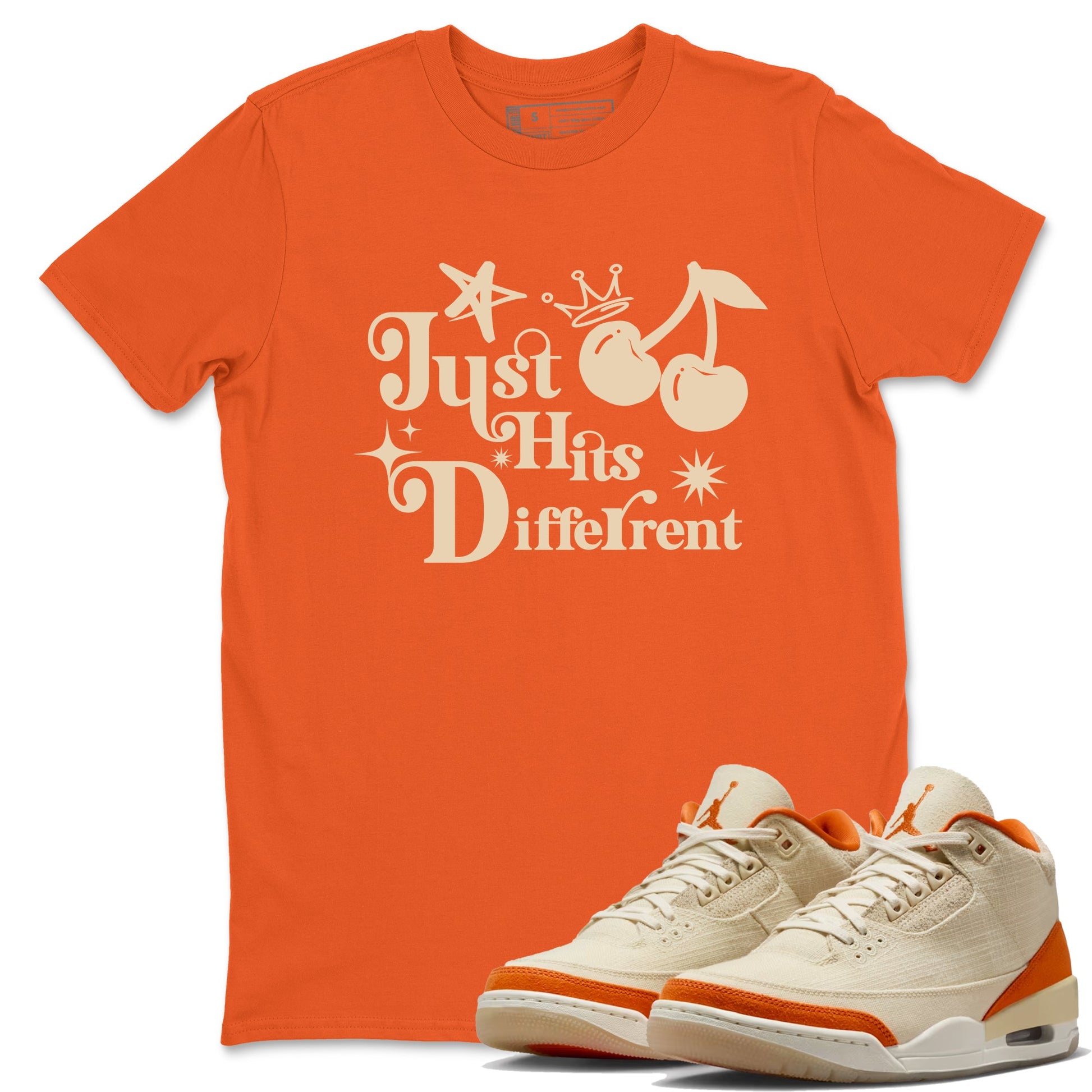 Just Hits Different sneaker match t-shirt styled to complete your fit with the Air Jordan 3 Starfish sneakers, shown in Orange 1.
