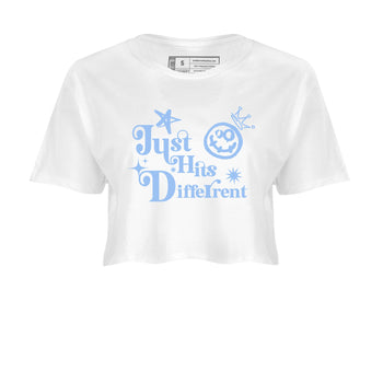 Just Hits Different womens crop tee made to vibe with the Air Jordan 4 Aluminum sneakers — the perfect match in White 2.