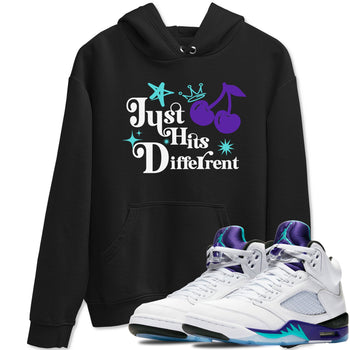 Just Hits Different sneaker match t-shirt styled to complete your fit with the Air Jordan 5 Grape sneakers, shown in Black 1.