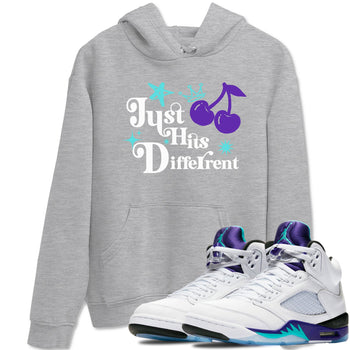 Just Hits Different sneaker match t-shirt styled to complete your fit with the Air Jordan 5 Grape sneakers, shown in Heather Grey 1.
