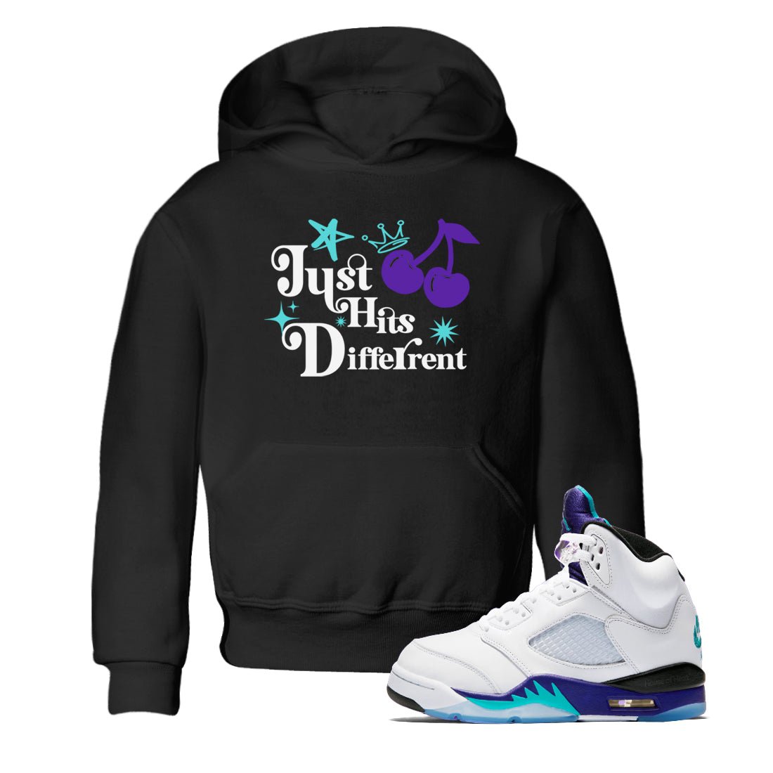 Just Hits Different baby and kids t-shirt crafted for little sneakerheads to shine with the Air Jordan 5 Grape sneakers, displayed in Black 1.