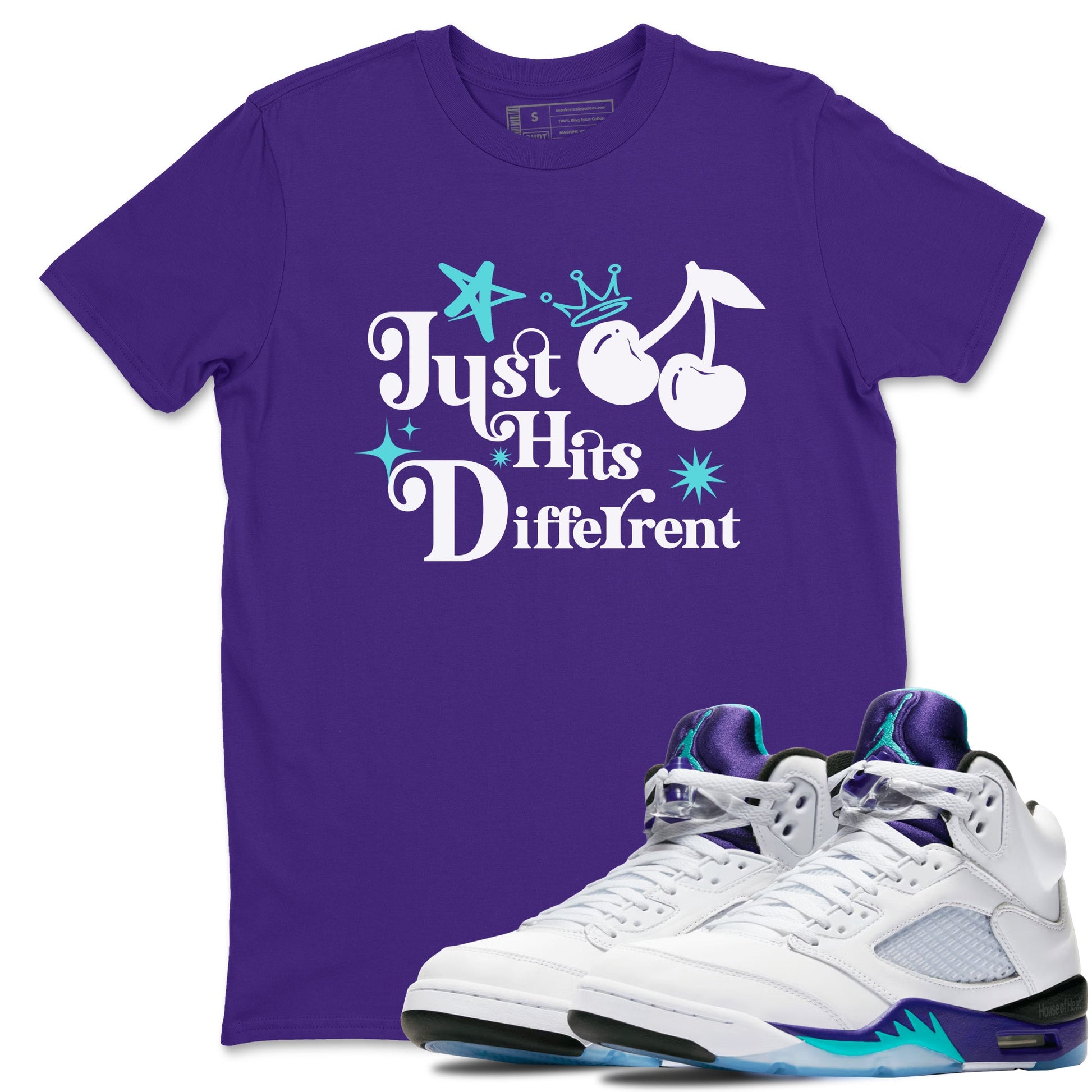 Just Hits Different sneaker match t-shirt styled to complete your fit with the Air Jordan 5 Grape sneakers, shown in Purple 1.