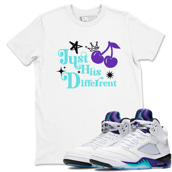 Just Hits Different sneaker match t-shirt styled to complete your fit with the Air Jordan 5 Grape sneakers, shown in White 1.