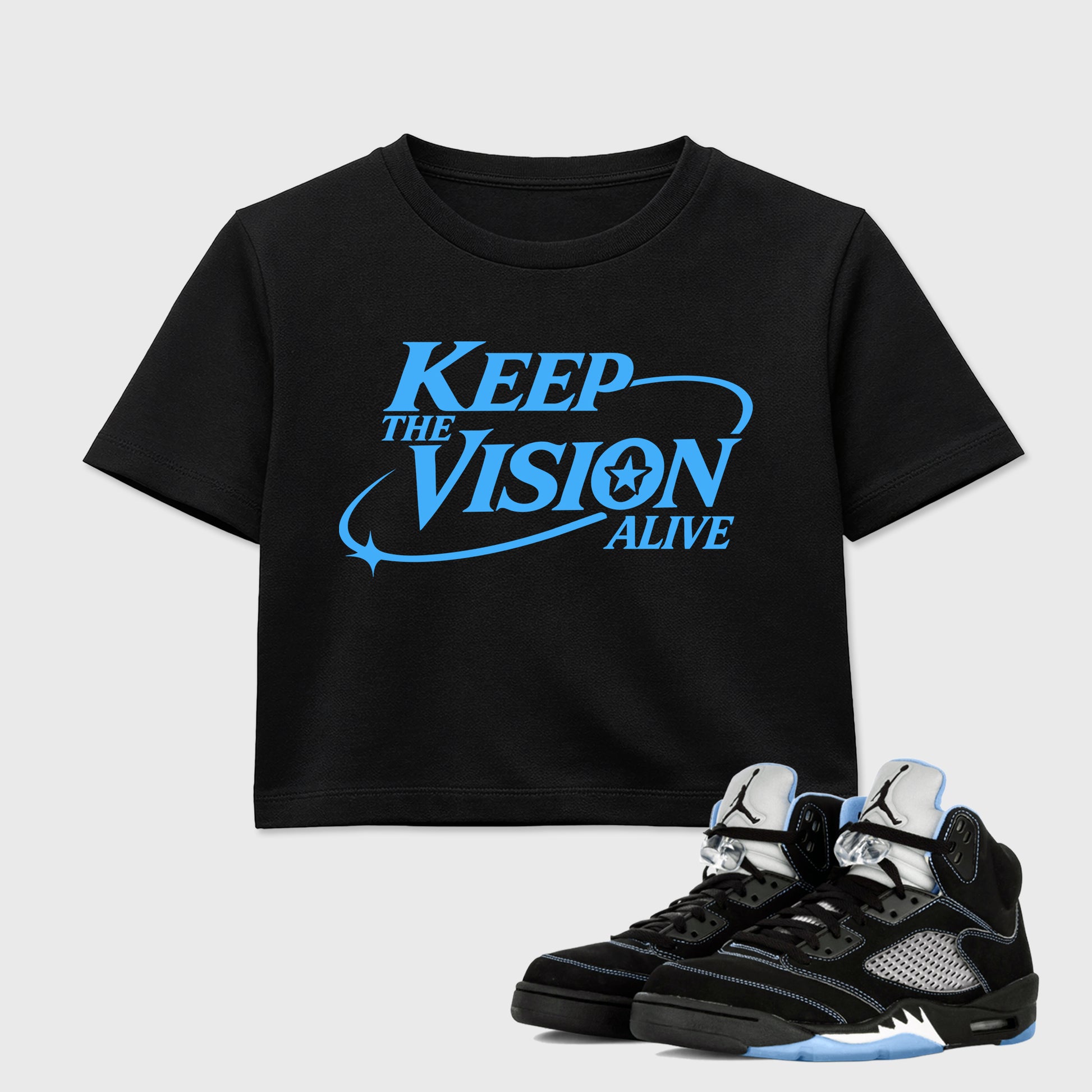 Keep The Vision Alive women’s crop tee designed to match the Air Jordan 5 Black Carolina, featuring coordinated Black 1 options for a perfect streetwear vibe.