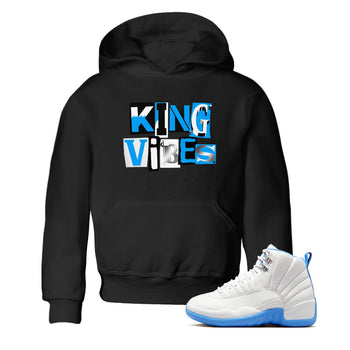 King Vibes baby and kids t-shirt crafted for little sneakerheads to shine with the Air Jordan 12 White and University Blue sneakers, displayed in Black 1.