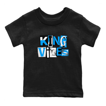 King Vibes baby and kids t-shirt crafted for little sneakerheads to shine with the Air Jordan 12 White and University Blue sneakers, displayed in Black 2.