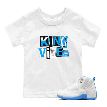 King Vibes baby and kids t-shirt crafted for little sneakerheads to shine with the Air Jordan 12 White and University Blue sneakers, displayed in White 1.