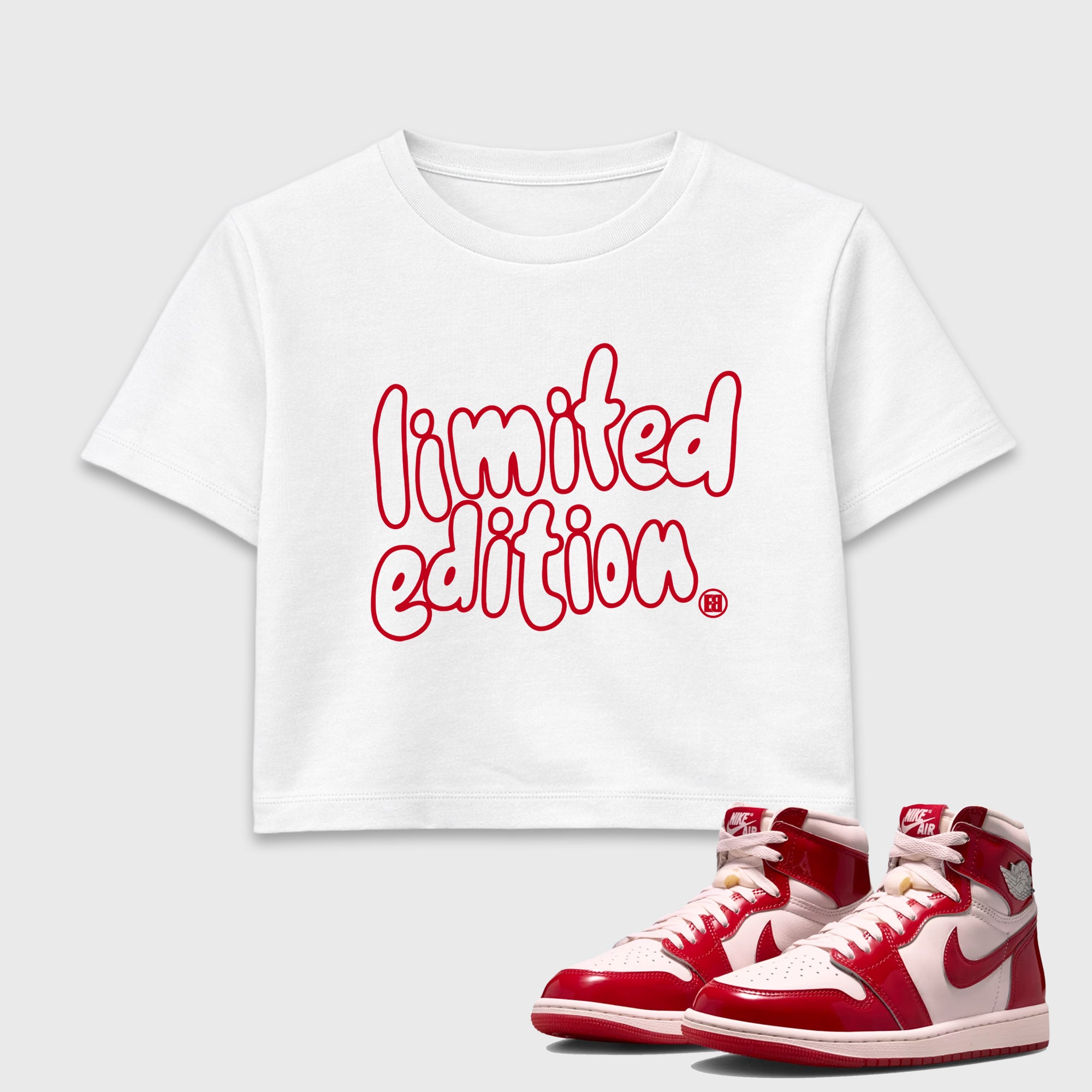 Limited Edition women’s crop tee designed to match the Air Jordan 1 Nails and Grails, featuring coordinated White 1 options for a perfect streetwear vibe.
