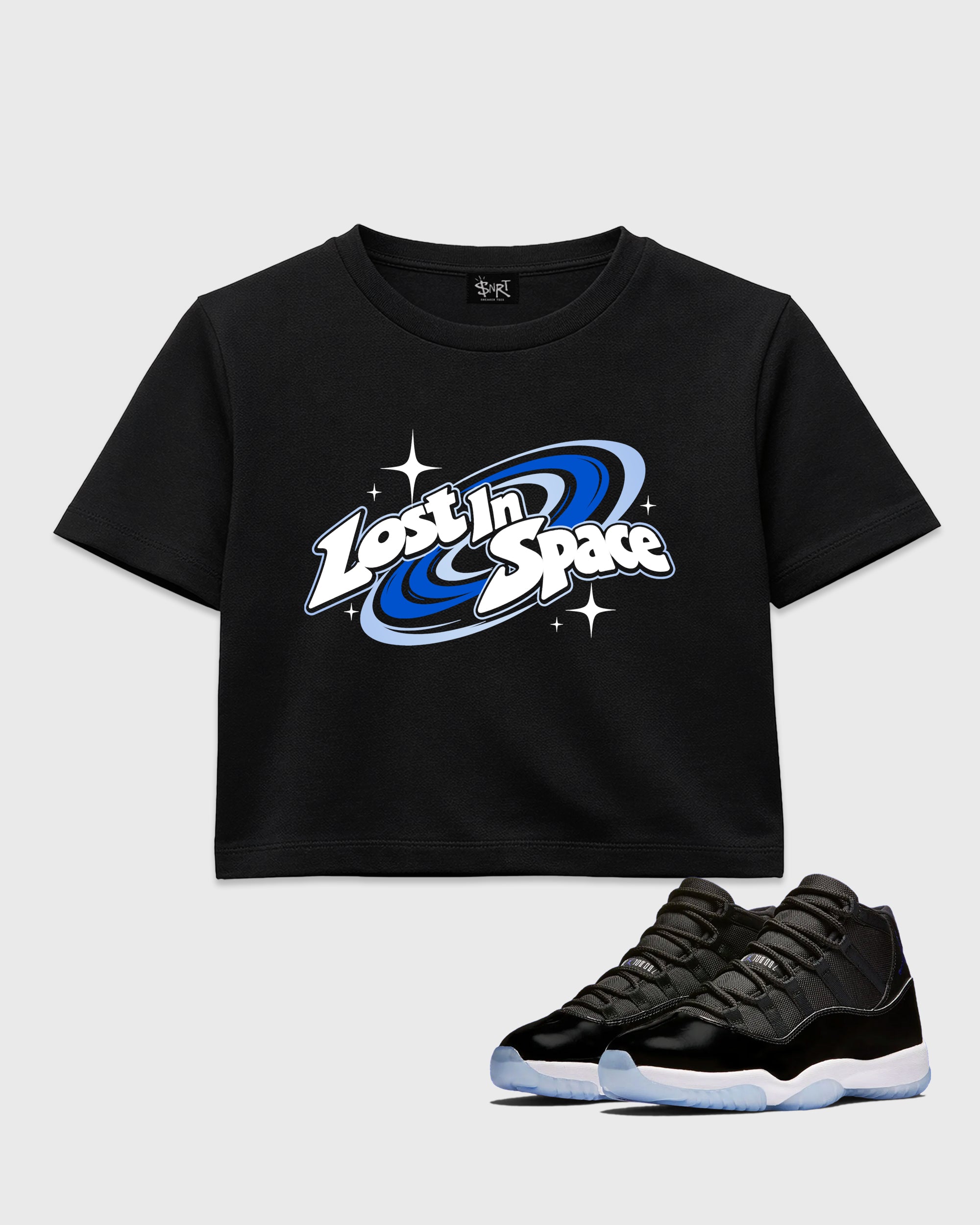 Lost in Space women’s crop tee designed to match the Air Jordan 11 Space Jam, featuring coordinated Black 1 options for a perfect streetwear vibe.