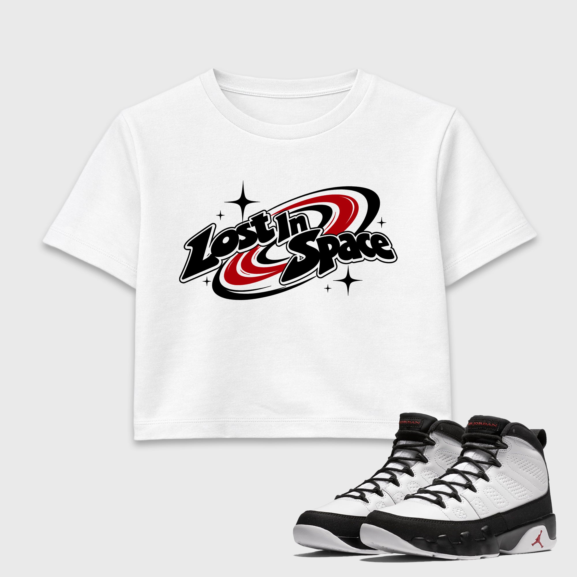 Lost in Space women’s crop tee designed to match the Air Jordan 9 True Red, featuring coordinated White 1 options for a perfect streetwear vibe.
