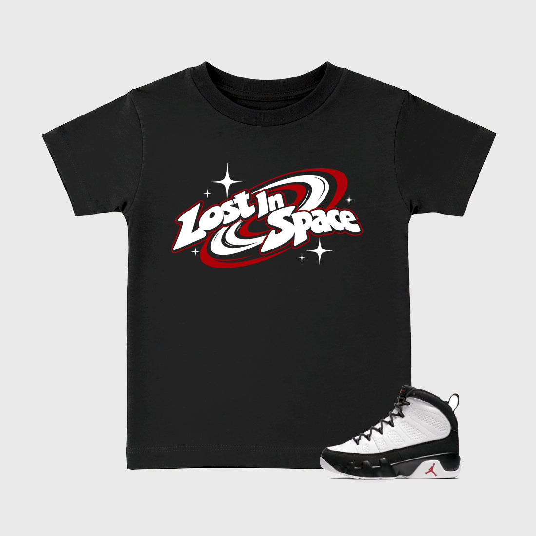 Lost in Space Baby & Kids Graphic T-Shirt featuring original artwork designed to match the Air Jordan 9 True Red. Black 1 Kids Graphic Tee.