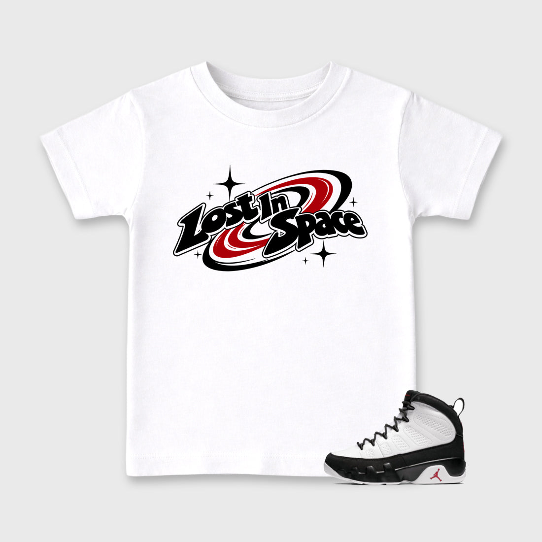 Lost in Space Baby & Kids Graphic T-Shirt featuring original artwork designed to match the Air Jordan 9 True Red. White 1 Kids Graphic Tee.
