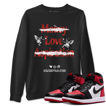 Love Conquers All Things sneaker match t-shirt styled to complete your fit with the Air Jordan 1 Ruby sneakers, shown in Black 1.