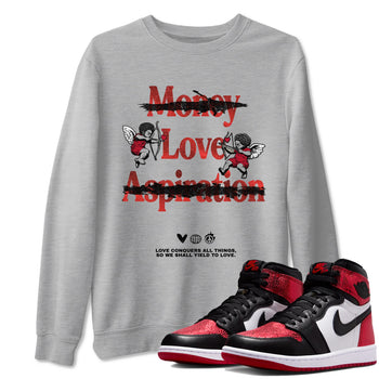Love Conquers All Things sneaker match t-shirt styled to complete your fit with the Air Jordan 1 Ruby sneakers, shown in Heather Grey 1.