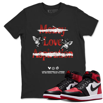 Love Conquers All Things sneaker match t-shirt styled to complete your fit with the Air Jordan 1 Ruby sneakers, shown in Black 1.