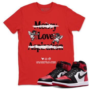 Love Conquers All Things sneaker match t-shirt styled to complete your fit with the Air Jordan 1 Ruby sneakers, shown in Red 1.