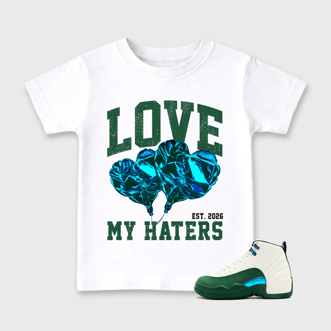 Love My Haters Baby & Kids Graphic T-Shirt featuring original artwork designed to match the Air Jordan 12 Summit Green. White 1 Kids Graphic Tee.