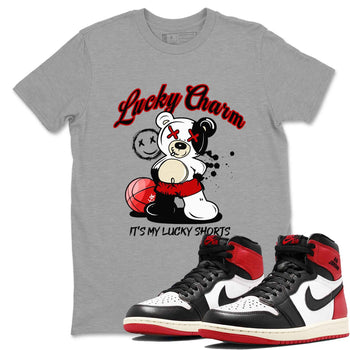 1s Black Toe Reimagined shirts to match jordans Lucky Charm best t shirts to wear with jordans AJ1 High OG Black Toe Reimagined match shoes to clothes SNRT Sneaker Tees unisex cotton Heather Grey 1 shirts