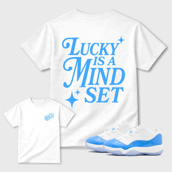 Lucky Is a Mindset front and back graphic t-shirt styled to complete your outfit with theAir Jordan 11 University Blue sneakers, shown in White.