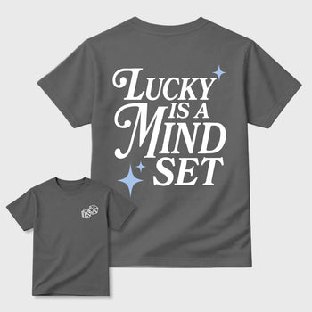 Lucky Is a Mindset front and back graphic t-shirt styled to complete your outfit with the5s White Metallic, shown in Cool Grey.