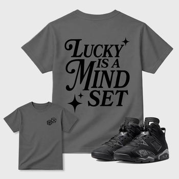 Lucky Is a Mindset graphic t-shirt styled to complete your sneaker outfit with the 6s Cap&Gown, shown in Cool Grey.