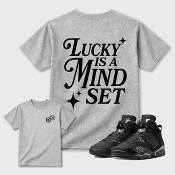 Lucky Is a Mindset graphic t-shirt styled to complete your sneaker outfit with the 6s Cap&Gown, shown in Heather Grey.