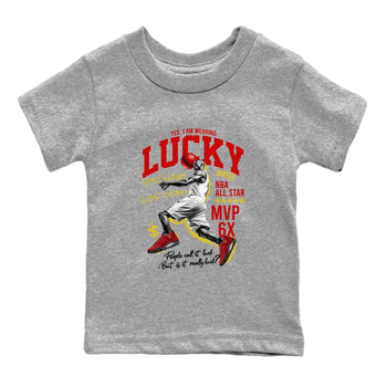 Lucky Player baby and kids t-shirt crafted for little sneakerheads to shine with the Air Jordan 14 Challenge Red sneakers, AJ14 Ferrari,  displayed in Heather Grey 2.