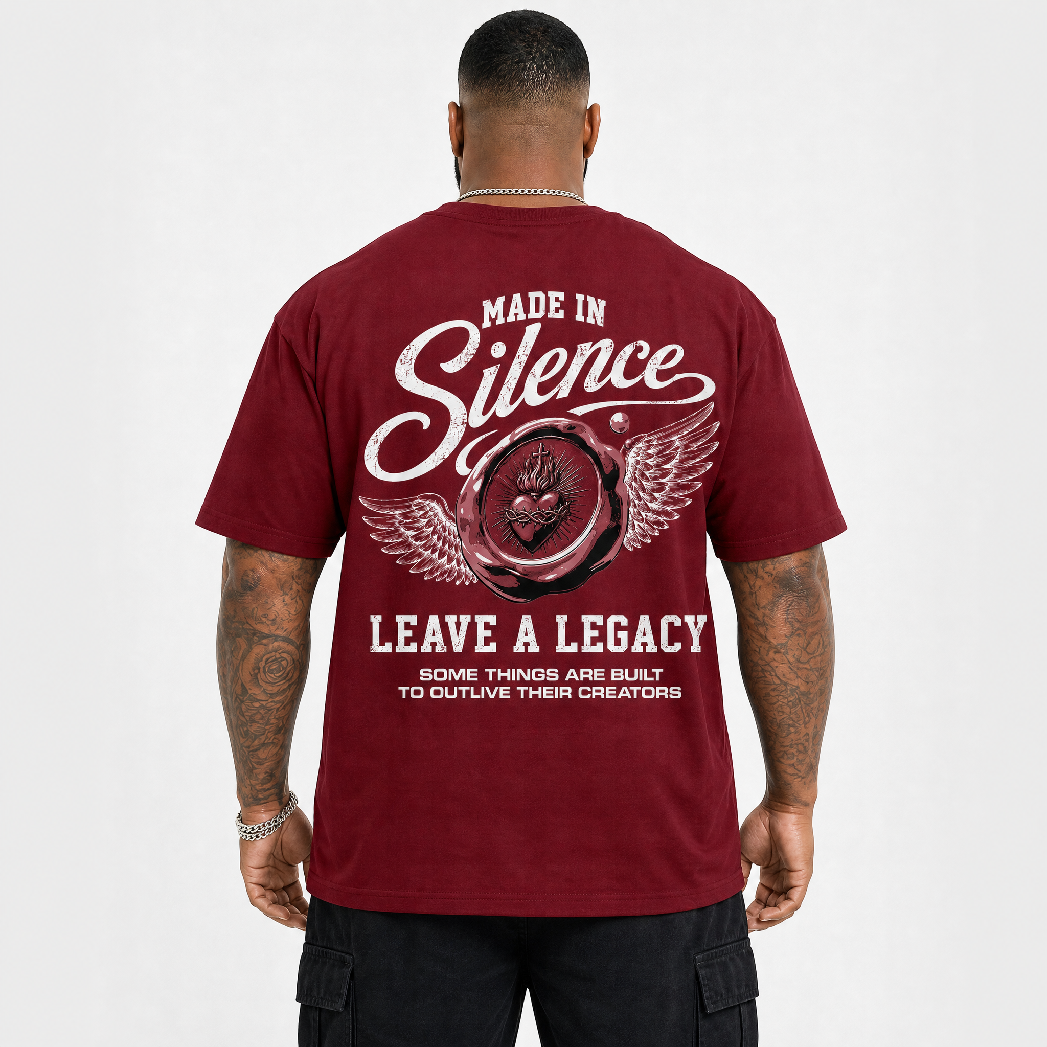 Person wearing a red t-shirt with text and design on the back, on a white background