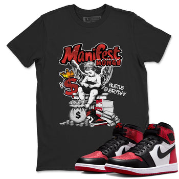 Manifest Money sneaker match t-shirt styled to complete your fit with the Air Jordan 1 Ruby sneakers, shown in Black 1.