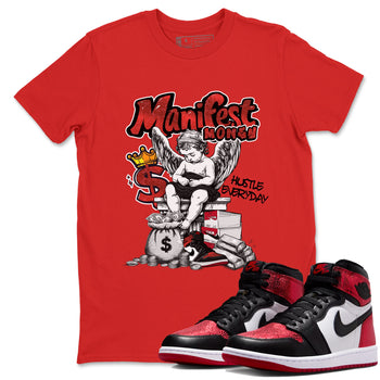 Manifest Money sneaker match t-shirt styled to complete your fit with the Air Jordan 1 Ruby sneakers, shown in Red 1.