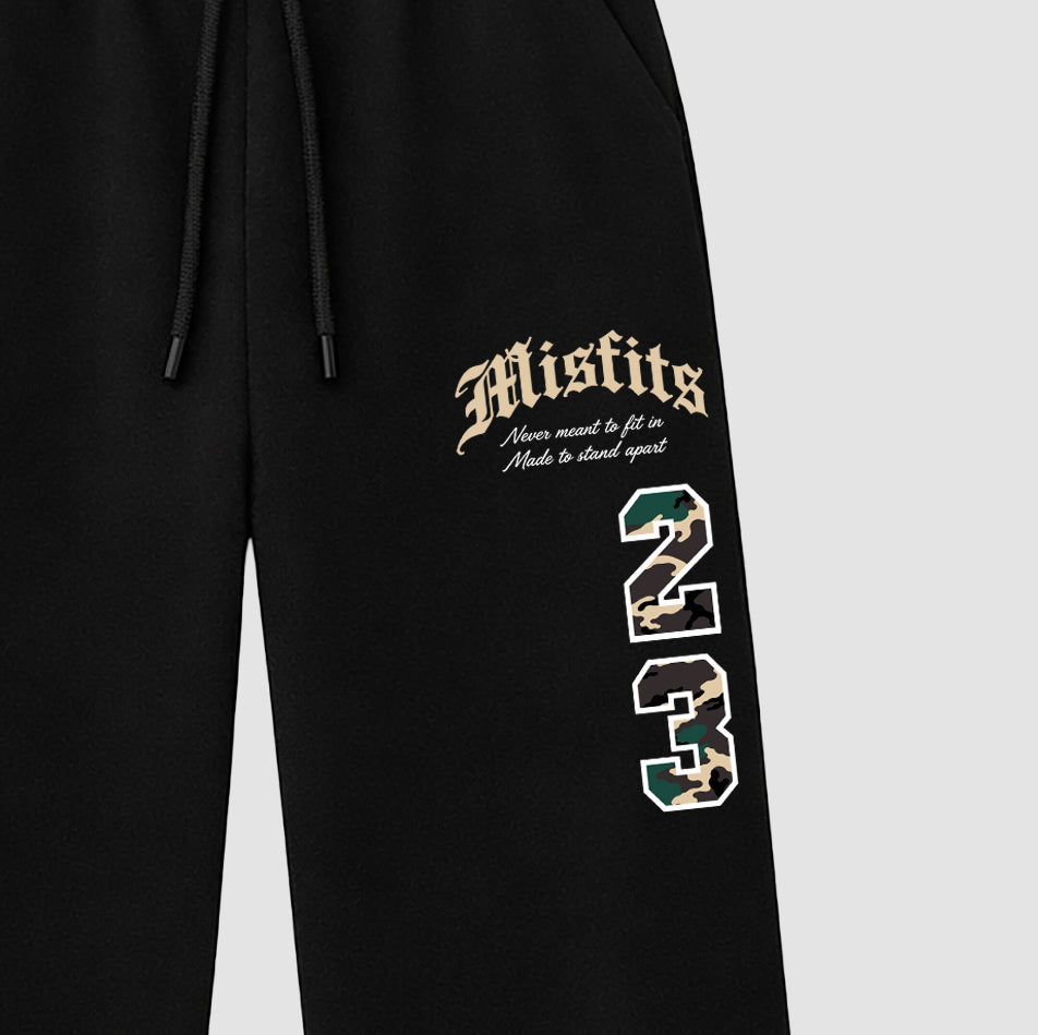 Misfits 23 graphic wide cut sweatpants designed to match the Air Foamposite Pro Green Camo, featuring coordinated Black 2 options for a perfect streetwear vibe.