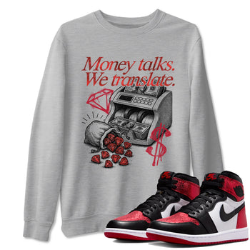 Money Talks We Translate sneaker match t-shirt styled to complete your fit with the Air Jordan 1 Ruby sneakers, shown in Heather Grey 1.
