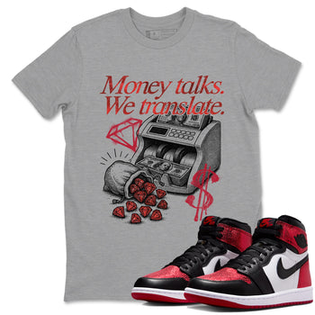 Money Talks We Translate sneaker match t-shirt styled to complete your fit with the Air Jordan 1 Ruby sneakers, shown in Heather Grey 1.