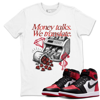 Money Talks We Translate sneaker match t-shirt styled to complete your fit with the Air Jordan 1 Ruby sneakers, shown in White 1.
