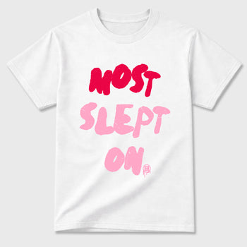 Most Slept On Graphic T-Shirt sneaker match tee designed for the Air Jordan 1 Travis Scott Tropical Pink, featuring coordinated color options for a perfect streetwear match. White 2 shirt.