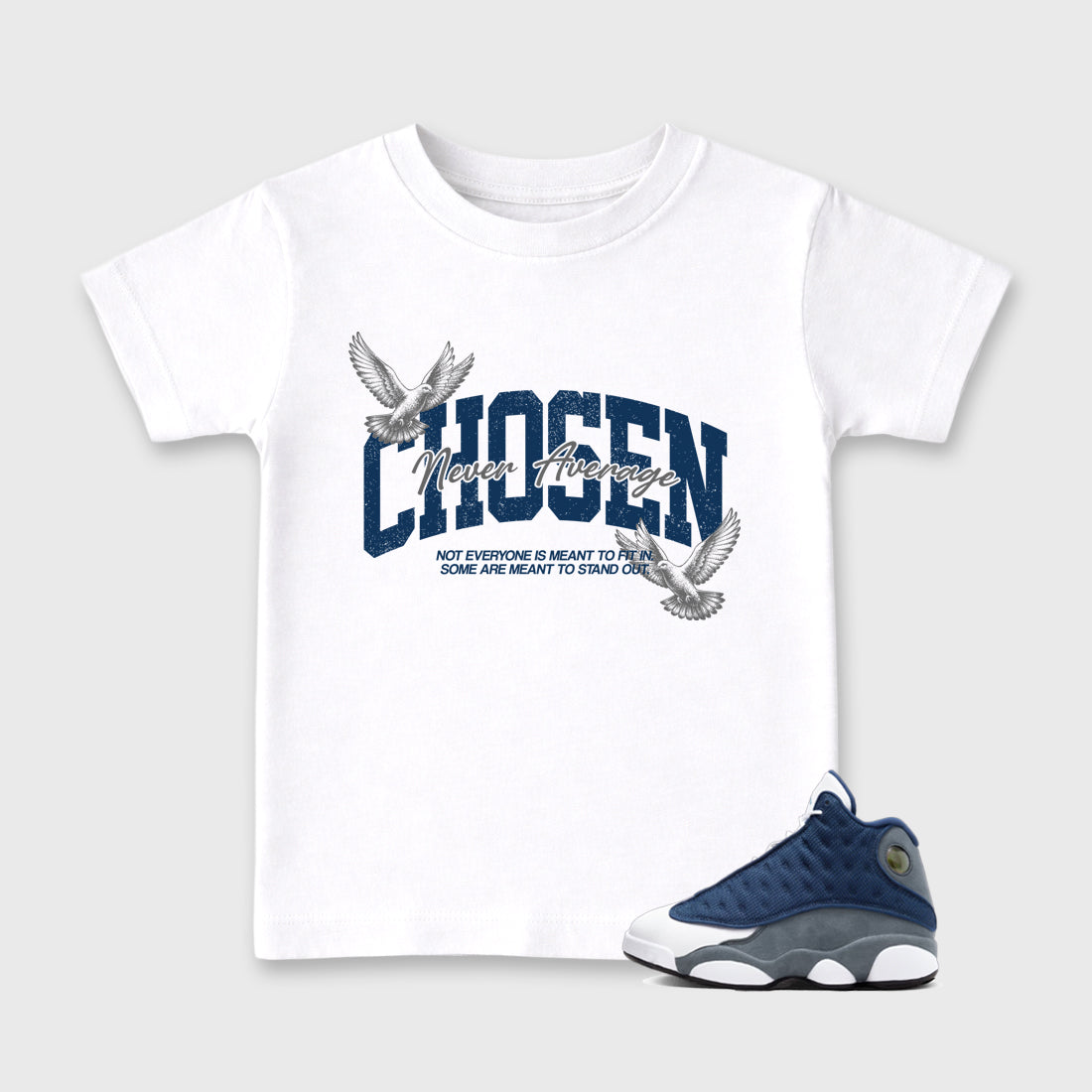 Never Average Baby & Kids Graphic T-Shirt featuring original artwork designed to match the Air Jordan 13 Flint. White 1 Kids Graphic Tee.