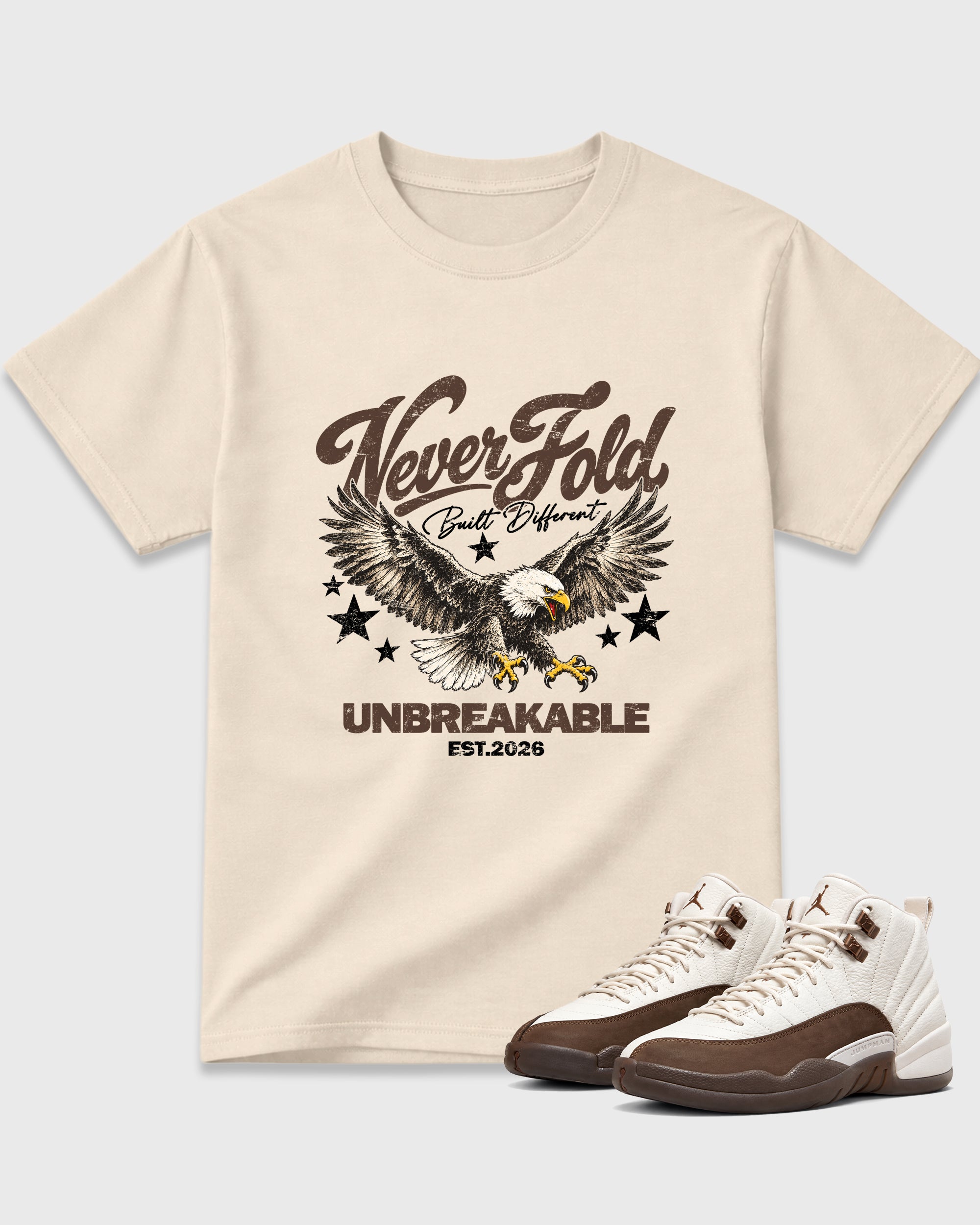 Never Fold Graphic T-Shirt featuring original streetwear artwork designed to match the Air Jordan 12 Fireside. Natural 1 Graphic T-Shirt.