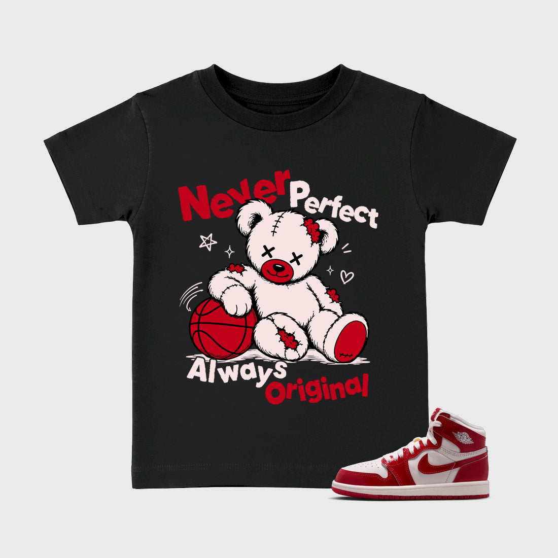 Never Perfect Always Original Baby & Kids Graphic T-Shirt featuring original artwork designed to match the Air Jordan 1 Nails and Grails. Black 1 Kids Graphic Tee.