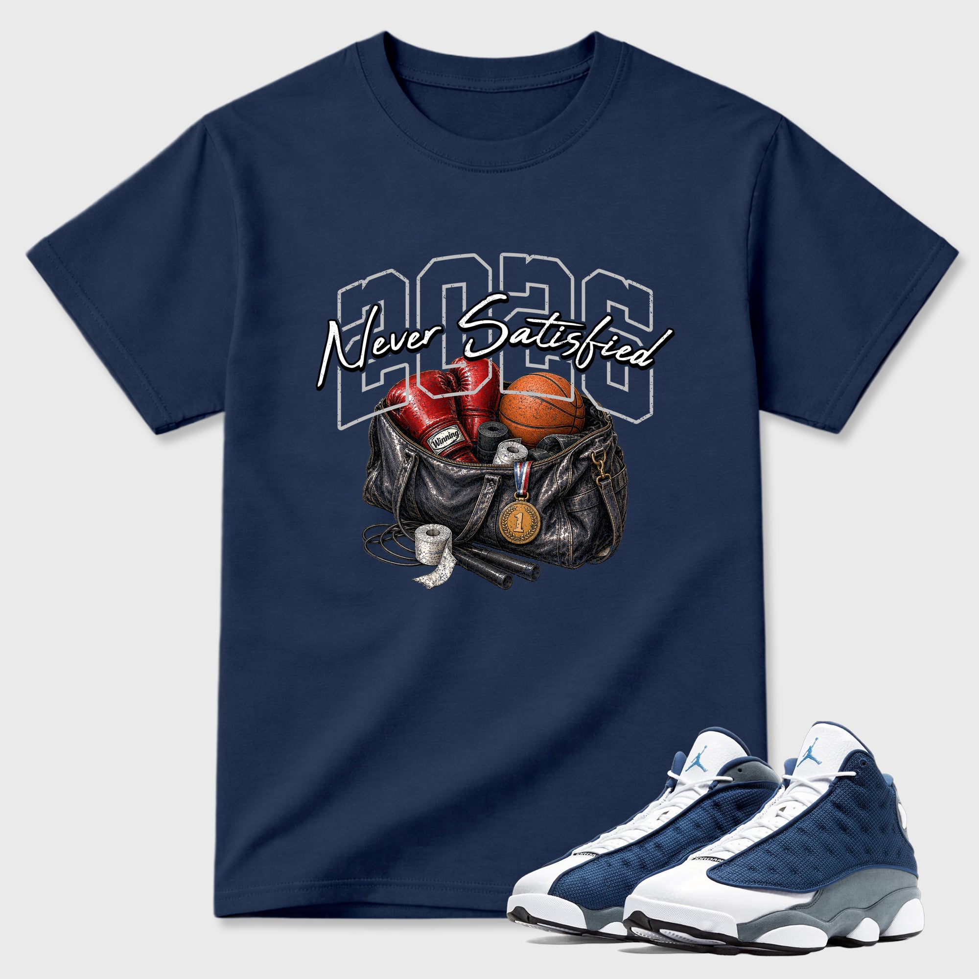 Never Satisfied Graphic T-Shirt featuring original streetwear artwork designed to match the Air Jordan 13 Flint. Navy 1 Graphic T-Shirt.
