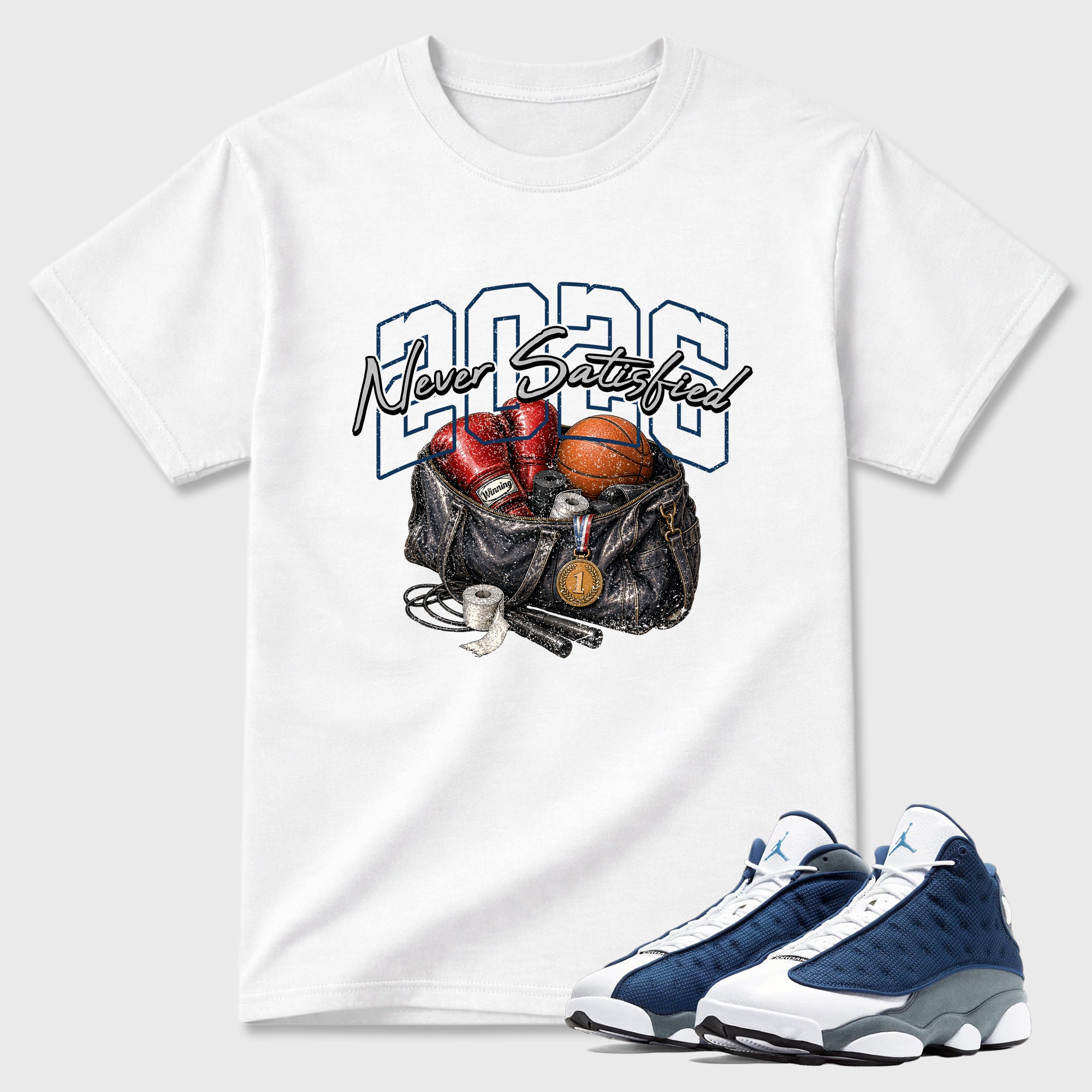 Never Satisfied Graphic T-Shirt featuring original streetwear artwork designed to match the Air Jordan 13 Flint. White 1 Graphic T-Shirt.