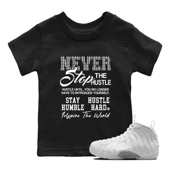Never Stop The Hustle baby and kids t-shirt crafted for little sneakerheads to shine with the Air Foamposite One Triple White sneakers, displayed in Black 1.